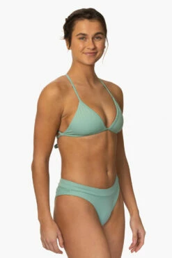 Alanna Bikini Bottom - Newport -JOLYN Sales Surf Bottoms Alanna Solid Newport SideFront MiaClark 011623