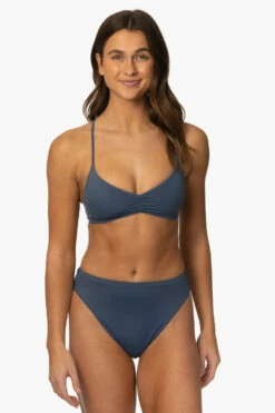 Leandra Bikini Bottom - Laguna -JOLYN Sales Surf Bottoms Leandra Solid Laguna Front MiaClark 011623