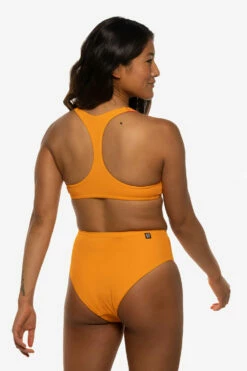 Natia Bikini Bottom - Mandarin 16 Natia Bikini Bottom - Mandarin -JOLYN Sales Swim Bottoms Natia Solid Mandarin Side Liz 052422