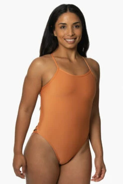 Gavin Swim Onesie - Tawny 9 Gavin Swim Onesie - Tawny -JOLYN Sales Swim Onesies Gavin Recycled Forever Solid Tawny SideFront KianiSouza 120122