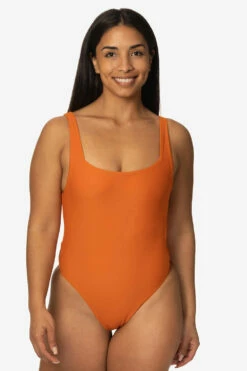 Nova Scotia Surf Onesie - Ginger -JOLYN Sales Swim Onesies Nova Scotia Solid Ginger Front TiaSurf KianiSouza 020923