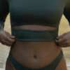 Taranaki Long Sleeved Crop Cut-Out Rashie - Eucalyptus -JOLYN Sales Swim Tops Taranaki Solid Eucalyptus Front Detail TiaSurf Lifestyle