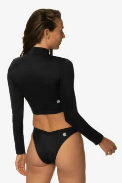 Tofino Long Sleeved Crop 1/4 Zip-up Rashie - Black 10 Tofino Long Sleeved Crop 1/4 Zip-up Rashie - Black -JOLYN Sales Swim Tops Tofino Solid Black Back Side TiaSurf MiskaSykora 021023