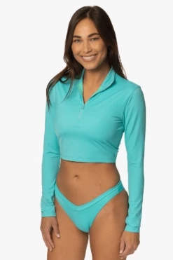 Tofino Long Sleeved Crop 1/4 Zip-up Rashie - Manifest 19 Tofino Long Sleeved Crop 1/4 Zip-up Rashie - Manifest -JOLYN Sales Swim Top Tofino Print Manifest SideFront LisaDillon 040323
